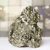 Pyrite raw crystal stone cluster reflecting willpower, action, and fortune.