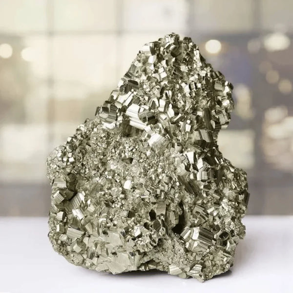 Pyrite raw crystal stone cluster reflecting willpower, action, and fortune.
