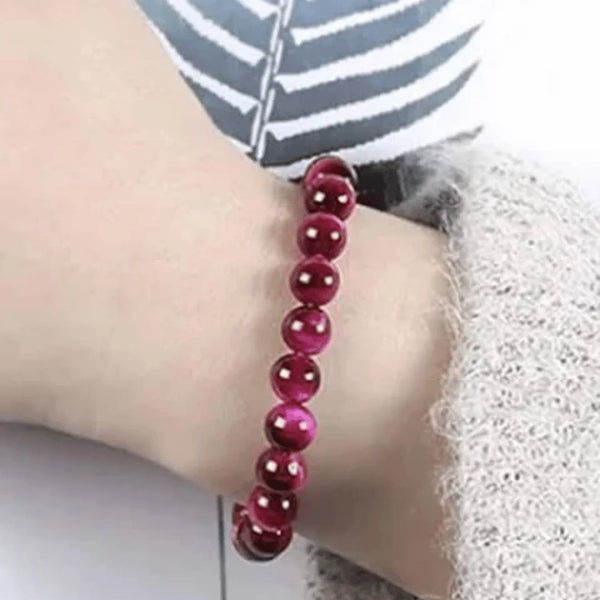 red-crystal-beaded-bracelet-on-wrist