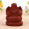Back shot of Red Jasper Ganesh crystal figurine in natural light, showing detailed carving for strength, success and protection.