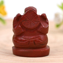 Load image into Gallery viewer, Back shot of Red Jasper Ganesh crystal figurine in natural light, showing detailed carving for strength, success and protection.
