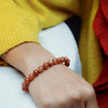 Motivation & Self-Belief - Red Sunstone Bracelet for drive, vitality, and a stronger sense of personal momentum - On Hand View | Natural Seven Chakra Crystal Bracelet for Success, Confidence & Career Growth