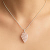 Rose quartz crystal arrowhead necklace designed for spiritual jewelry and self-love