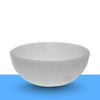 Crystal cleansing ritual with a selenite bowl for clearing negative energy