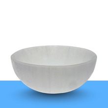 Load image into Gallery viewer, Crystal cleansing ritual with a selenite bowl for clearing negative energy
