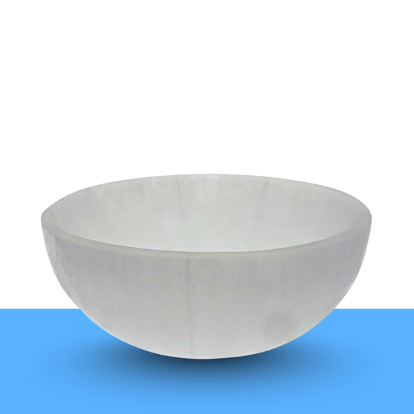 Crystal cleansing ritual with a selenite bowl for clearing negative energy