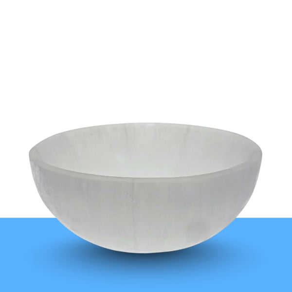 Crystal cleansing ritual with a selenite bowl for clearing negative energy