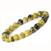 Protection & Emotional Wellness - Serpentine Bracelet for calm energy and daily balance - Close Up Detail Texture | Natural Seven Chakra Crystal Bracelet for Evil Eye Protection & Negative Energy Shield