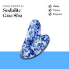 Sodalite Gua Sha face crystal displayed for relaxing, focusing and enhancing facial expression.