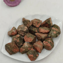 Load image into Gallery viewer, Unakite raw stones displayed on a white plate, symbolizing balance, healing, and growth.
