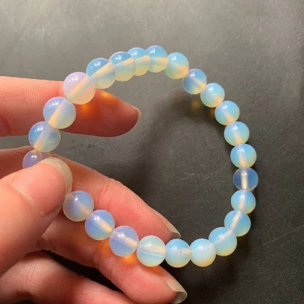 Lifestyle shot of a Opal bracelet on a person's wrist, emphasizing comfort and beauty.